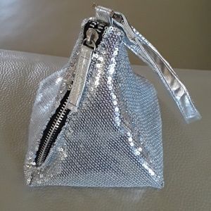 Wrist bag. No tags, but never used.